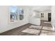 Bright, open living space with hardwood floors and a view into the adjacent kitchen with white cabinetry at 1106A Wedgewood Nw Dr, Atlanta, GA 30318