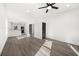 Open-concept living area with sleek flooring, a ceiling fan, and natural light, flowing into the kitchen at 1106A Wedgewood Nw Dr, Atlanta, GA 30318