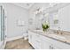 Bright bathroom featuring double vanities with granite countertops and modern fixtures at 1311 English Nw St, Atlanta, GA 30318