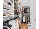 Organized walk-in closet with shelving and hanging rods, maximizing storage space and efficiency at 1311 English Nw St, Atlanta, GA 30318