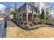 View of the exterior elevated deck and landscaping of the home at 1311 English Nw St, Atlanta, GA 30318