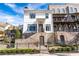 Charming two-story home with a brick foundation, black iron fence, and beautifully landscaped yard at 1311 English Nw St, Atlanta, GA 30318