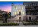 Beautiful modern farmhouse with a brick foundation, black iron fence, and professional landscaping at 1311 English Nw St, Atlanta, GA 30318