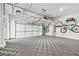 Spacious garage with overhead storage and a patterned floor at 1311 English Nw St, Atlanta, GA 30318