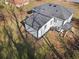 Aerial shot highlighting the backyard of a home, featuring a small deck area and an attached garage at 1931 Selwyn Dr, Decatur, GA 30035