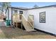 Back porch featuring a modern staircase and door to the backyard at 1931 Selwyn Dr, Decatur, GA 30035