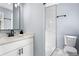 Contemporary bathroom featuring a sleek white vanity, black hardware, and a stylish, tiled walk-in shower at 1931 Selwyn Dr, Decatur, GA 30035