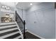 Hallway features stairs with elegant railings and convenient access to the laundry area at 1931 Selwyn Dr, Decatur, GA 30035