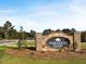 Oakleigh Glen community entrance sign with brick pillars, greenery and surrounding landscaping at 204 Oak View Ln, Dallas, GA 30157