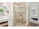 Modern bathroom featuring a glass shower, a vanity with marble countertop, and view to Primary bedroom at 560 Collier Nw Rd, Atlanta, GA 30318