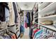 Walk-in closet with custom shelving, ample storage, and organized clothing racks at 560 Collier Nw Rd, Atlanta, GA 30318