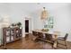 Cozy dining room with a rustic wooden table, stylish chairs, and modern decor at 560 Collier Nw Rd, Atlanta, GA 30318