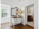 Entryway featuring hardwood floors, a decorative mirror, and a glimpse into an adjacent room at 560 Collier Nw Rd, Atlanta, GA 30318