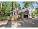 Beautiful two-story home with a gated entrance and an outdoor entertainment area on the second floor at 560 Collier Nw Rd, Atlanta, GA 30318