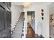 Bright foyer with staircase, decorative lighting, hardwood floors, and stylish decor at 560 Collier Nw Rd, Atlanta, GA 30318