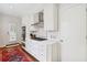 Modern kitchen with white cabinetry, stainless steel appliances, and subway tile backsplash at 560 Collier Nw Rd, Atlanta, GA 30318