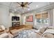 Comfortable living room featuring coffered ceilings, nice furniture, and ample natural light at 560 Collier Nw Rd, Atlanta, GA 30318