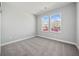 Cozy bedroom with neutral carpet and natural light from two windows at 144 Laurel Farms Ln, Dallas, GA 30157