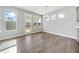 Bright dining area with large windows and a view to the outdoor patio at 144 Laurel Farms Ln, Dallas, GA 30157