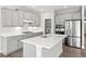 Well-appointed kitchen featuring gray cabinets, a center island with a sink, and stainless-steel appliances at 144 Laurel Farms Ln, Dallas, GA 30157