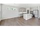 Spacious kitchen featuring gray cabinets, a center island, and stainless-steel appliances at 144 Laurel Farms Ln, Dallas, GA 30157