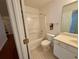 Bathroom with a shower/tub combo and a large mirror above the sink at 1854 Brittlebank Ln, Lawrenceville, GA 30043