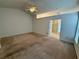 Spacious bedroom featuring a ceiling fan, carpet, and an ensuite bathroom at 1854 Brittlebank Ln, Lawrenceville, GA 30043