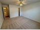 Spacious bedroom with neutral carpet and access to bathroom and closet at 1854 Brittlebank Ln, Lawrenceville, GA 30043