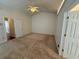 Large bedroom featuring a ceiling fan, carpet and neutral paint at 1854 Brittlebank Ln, Lawrenceville, GA 30043