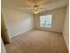 Bedroom with neutral carpet, ceiling fan, and natural light at 1854 Brittlebank Ln, Lawrenceville, GA 30043