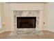 Fireplace featuring a marble surround and white molding at 1854 Brittlebank Ln, Lawrenceville, GA 30043