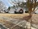 Well-manicured lawn and landscaping accentuates this one-story home in a suburban neighborhood at 1854 Brittlebank Ln, Lawrenceville, GA 30043