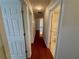 Hallway with wood flooring and white doors at 1854 Brittlebank Ln, Lawrenceville, GA 30043