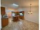 Spacious kitchen with a kitchen island, wood cabinets, and a dining area at 1854 Brittlebank Ln, Lawrenceville, GA 30043