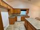 Kitchen featuring an island and wood cabinets at 1854 Brittlebank Ln, Lawrenceville, GA 30043