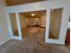 Living room featuring an open archway and carpet at 1854 Brittlebank Ln, Lawrenceville, GA 30043