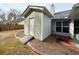 Exterior view of shed with ramp and white door next to the covered patio at 1854 Brittlebank Ln, Lawrenceville, GA 30043