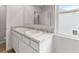 Bathroom with granite countertops, double sinks, and a large mirror at 206 Oak View Ln, Dallas, GA 30157