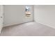 Bedroom featuring neutral walls, carpeting, and a window offering natural light at 206 Oak View Ln, Dallas, GA 30157