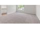 Spacious bedroom with plush carpeting and a view out the window at 206 Oak View Ln, Dallas, GA 30157
