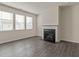 Cozy living room has a fireplace, three windows, and vinyl flooring at 206 Oak View Ln, Dallas, GA 30157