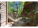 Backyard landscaping with deck and gazebo in a lush wooded setting at 2235 Six Branches Dr, Roswell, GA 30076