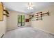 The large bedroom features carpet, shelving and a window with natural light and outdoor views at 2235 Six Branches Dr, Roswell, GA 30076