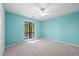A lovely bedroom featuring carpet, a ceiling fan, and natural light from the outdoor view at 2235 Six Branches Dr, Roswell, GA 30076