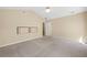 Bedroom with neutral carpet, vaulted ceiling, and doorway to additional living space at 2235 Six Branches Dr, Roswell, GA 30076