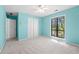 A charming bedroom with a ceiling fan, spacious closet, carpet, and plenty of natural light at 2235 Six Branches Dr, Roswell, GA 30076