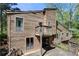 Exterior view of home shows multi-level decks at 2235 Six Branches Dr, Roswell, GA 30076