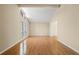 Bright living room featuring hardwood floors, ample natural light, and neutral color scheme at 2235 Six Branches Dr, Roswell, GA 30076