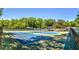 Multiple tennis courts in a community surrounded by mature shade trees at 2235 Six Branches Dr, Roswell, GA 30076