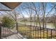 Water view from the balcony, showcasing mature trees and outdoor space at 4084 Columns Dr, Marietta, GA 30067